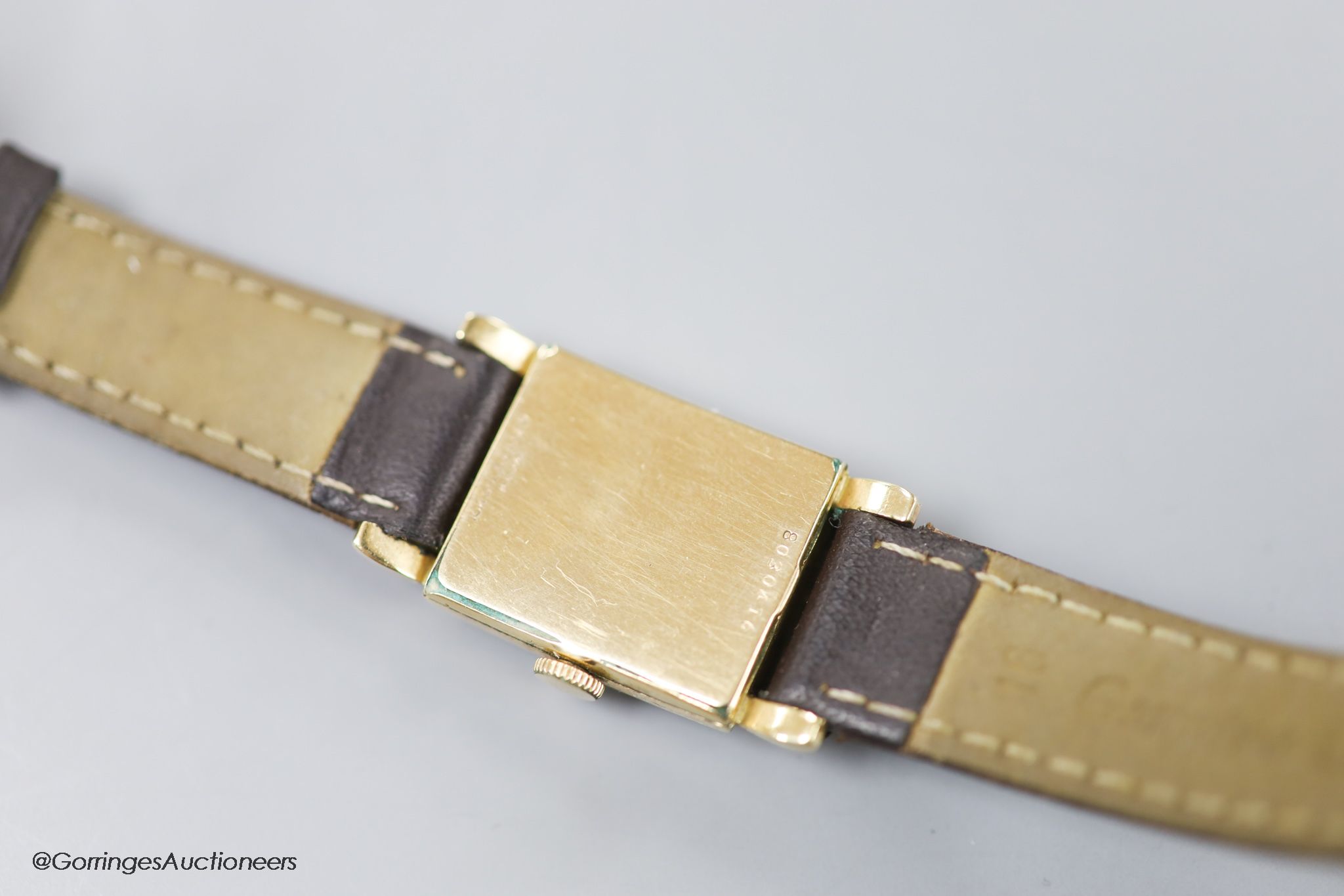 A gentleman's 1930's 10k gold filled Bulova manual wind wrist watch, with green enamel rectangular dial and subsidiary seconds, on later leather strap.